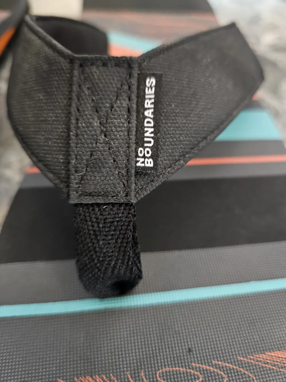 No Boundaries Men’s Black Flip-Flops with Orange and Teal Stripes